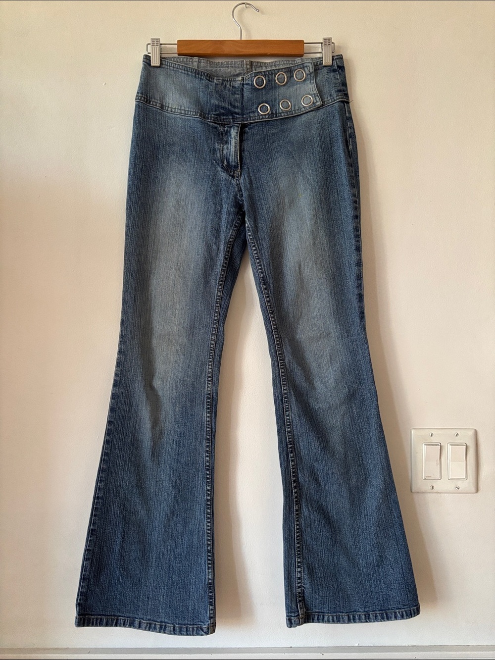 High-Rise Blue Flare Jeans with Grommet Waist Detail